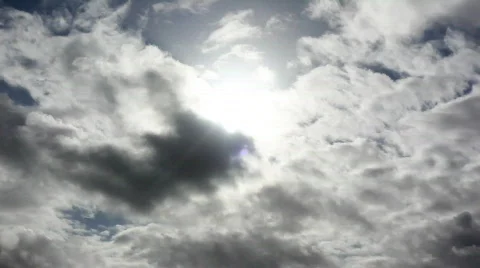 Bursting timelapse clouds against the sun. Stock Footage 311667