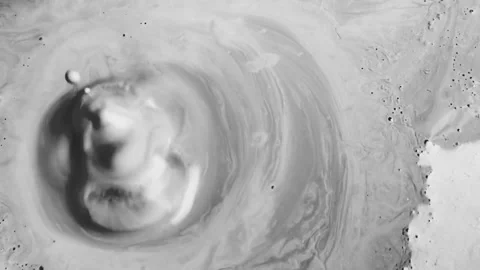 Bursts of dirt on the surface. Slow-motion. Liquid clay in the workshop of the s Stock Footage 132665823