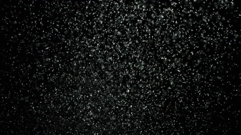 Bursts of white dust on black background. Stock footage. Explosion streams of Stock Footage 106862821