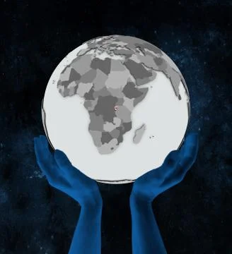 Burundi on globe in hands Stock Illustration