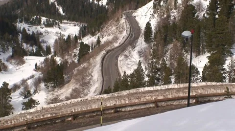 Bus on an Alpine Road Stock Footage 1038094