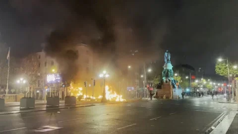 Bus and car on fire on O'Connell Street, Dublin following knife attack  Stock Footage 256247882
