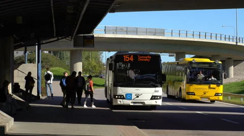 The bus arrives at the bus stop and the passengers boarding. Stock Footage