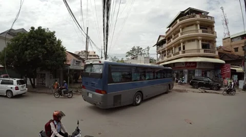Bus, car and motorcycle traffic on a typical city street. Video 4k Vidéo 61746053