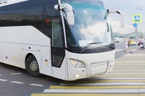 Bus at the city intersectio Stock Photos