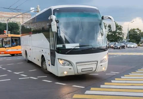 Bus at the city intersectio Stock Photos