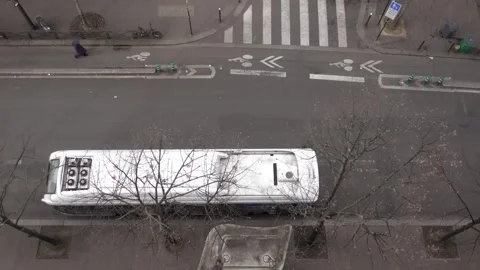 Bus coach pulling away from stop in Paris suburbs 4K 24FPS Stock Footage 265061271