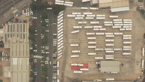 Bus depot tracking shot as one vehicle moves into position. Stock Footage 231743513