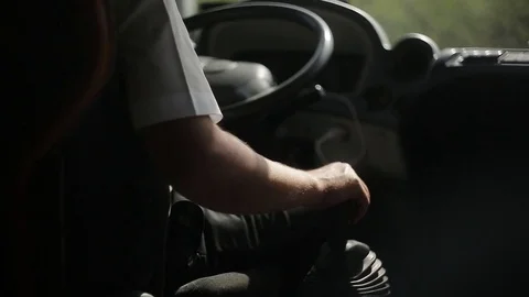 The bus driver is driving along the road. Stock Footage 76928808