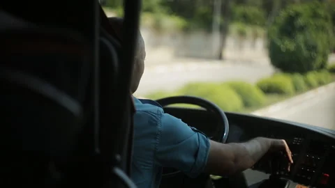 The bus driver is driving along the road. Stock Footage 91506854