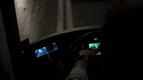 Bus driver driving in the evening twilight hours. Front of bus driving at night Stock Footage 101541476