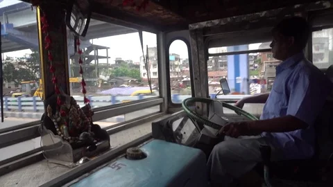 Bus driver driving a passenger bus Stock Footage 77497831