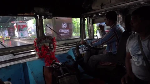 Bus driver driving a passenger bus Vídeos de archivo 77664423