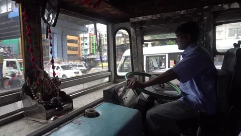 Bus driver smoking in a passenger bus Stock Footage 77498896