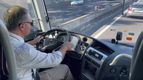 Bus Driver Steering Through Busy City Highway Stock Footage 318346917