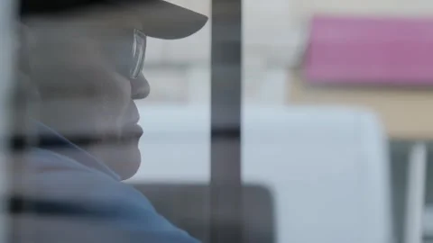 Bus Driver in Uniform Looking Through Window Stock Footage 253705433