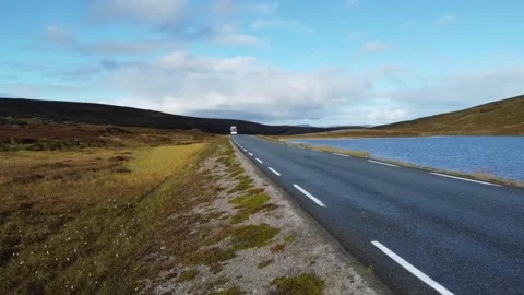 Bus drives along Stock Footage 209642269