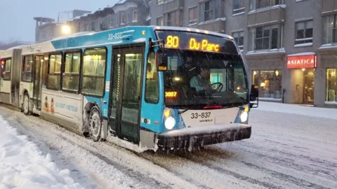 Bus drives down snow covered road Stock Footage 131180922