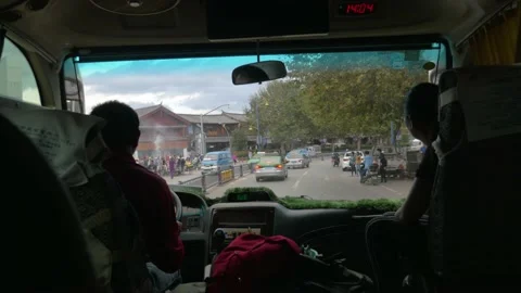 The bus drives through the crowded streets of a big city, in China Stock Footage 232152230