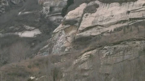 Bus driving on mountain road Stock Footage 253773843