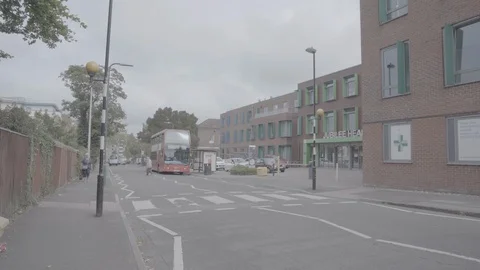 Bus driving past (suburbs) Stock Footage 116553795