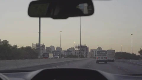 Bus driving on road during dusk Stock Footage 85754187