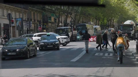 Bus driving through Paris traffic Stock Footage 250923185