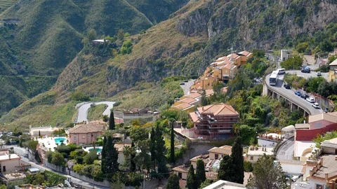 Bus driving winding road down the hill in Sicily Stock Footage 108112742