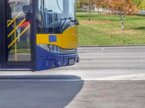 Bus front part on bus stop in the city ready to take passengers Stock Photos