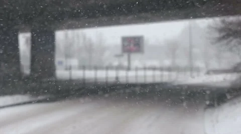 Bus getting under the bridge during snowfall Stock Footage 59700511