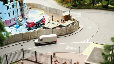 The bus goes along the route - a model of the city and the railway 動画素材 197682681