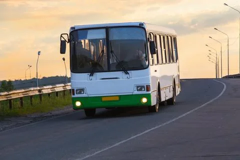 Bus goes on highway Stock Photos
