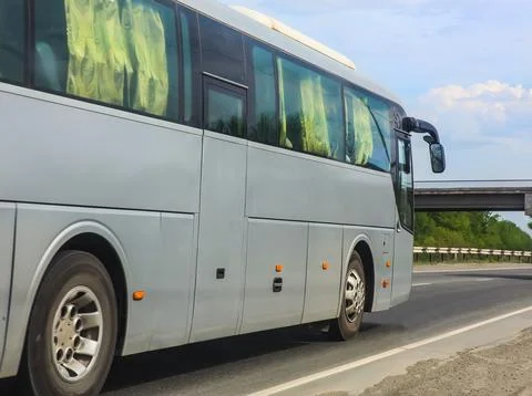 Bus goes on highway Stock Photos