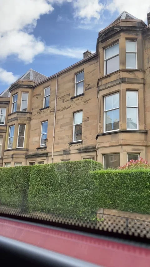 Bus going past terraced properties towards Edinburgh. Stock Footage 170903891