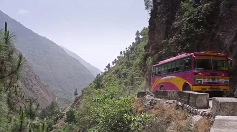 Bus going through mountain pass in India Stock Footage