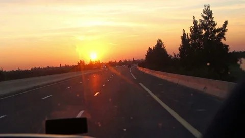 Bus in the highway at the sunset time Stock Footage 129530166