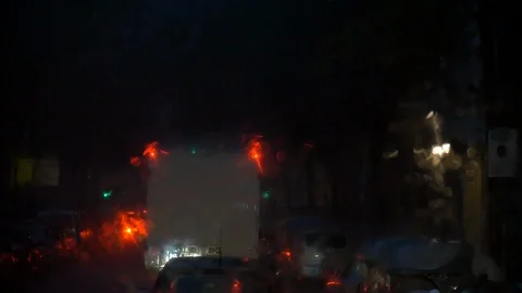 Bus indow wipers working in a heavy rainfall at night Stock Footage 99176283