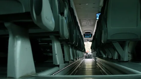 Bus, interior. Empty corridor during the trip. Low POV Stock Footage 90768164