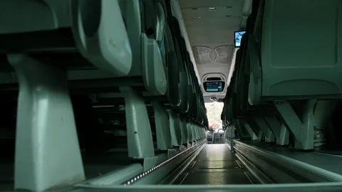 Bus, interior. Empty corridor during the trip. Low POV Stock Footage 91292983