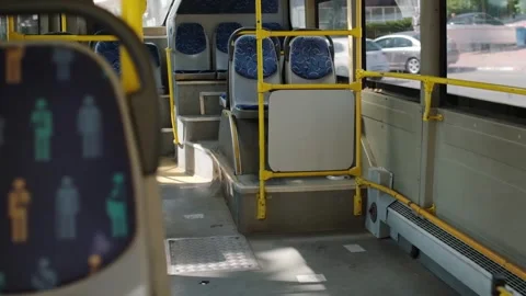 Bus Interior Showcasing Empty Seats and Bright Natural Light on a Sunny Day Stock Footage 312272134