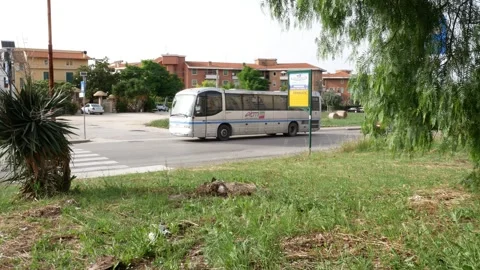 A bus leaves after a stop Stock Footage 244595296