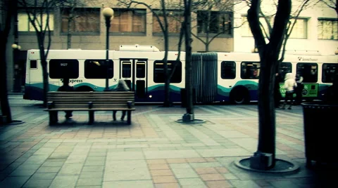 Bus leaving the bust station crane shot Stock Footage 1076579
