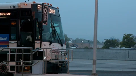 Bus Loading with Traffic Stock-Footage 98896664