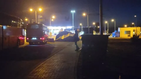 Bus Loads of Ukrainians Waiting to escape Ukraine into Poland at Border 動画素材 239595545