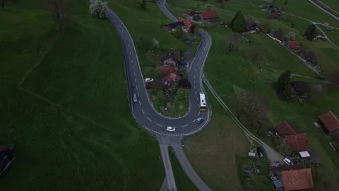 Bus navigating mountain hairpin turn with traffic Stock Footage 333011918