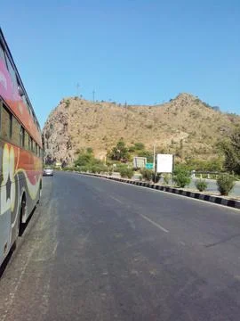 A bus parked on the road side going towards hills in India Stock-Fotos