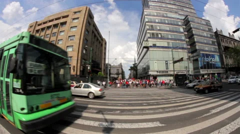 Bus pass through the fisheye camera distorting the bus, people cross the street. Stock Footage 52510040