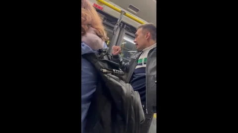 Bus Passenger Defends Himself During Tense Altercation Stock Footage 331253098