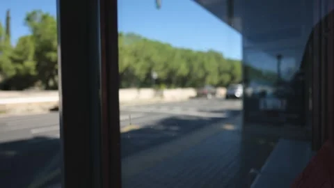 Bus Passes Bus Stop on Blurred Background. Slow Motions. 4K Stock Footage 287589658