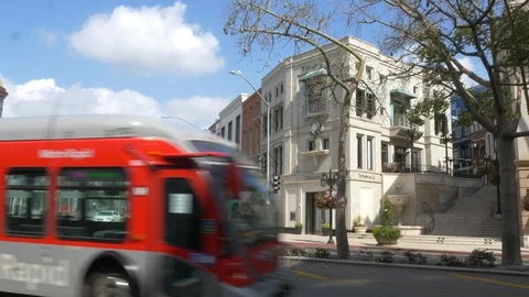 A bus passes on an empty Wilshire &amp; Rodeo Drive Video stock 127404647